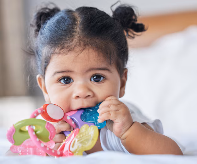 teething solutions, best pediatric dentist in Junagadh, children dentist in Junagadh, teething toys, baby teething remedies, teething pain relief, safe teething solutions, teething symptoms, gum massage for babies, silicone teething toys, teething rings, wooden teething toys, oral care for babies, infant dental care, best dental clinic in Junagadh, baby teething mittens, teething practices to avoid, teething consultation, baby oral health, Parshvi Dental Care