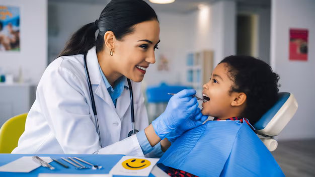 fluoride varnish, pediatric dentist in Junagadh, children dental clinic Junagadh, kids dentist in Junagadh, fluoride treatment for kids, cavity prevention, dental care for children, enamel protection, fluoride for children, tooth decay prevention, fluoride benefits, Parshvi Dental Care, dental clinic in Junagadh, best pediatric dental care, kids oral health, fluoride application, children’s dental treatment, dental clinic for kids, early cavity treatment, enamel strengthening